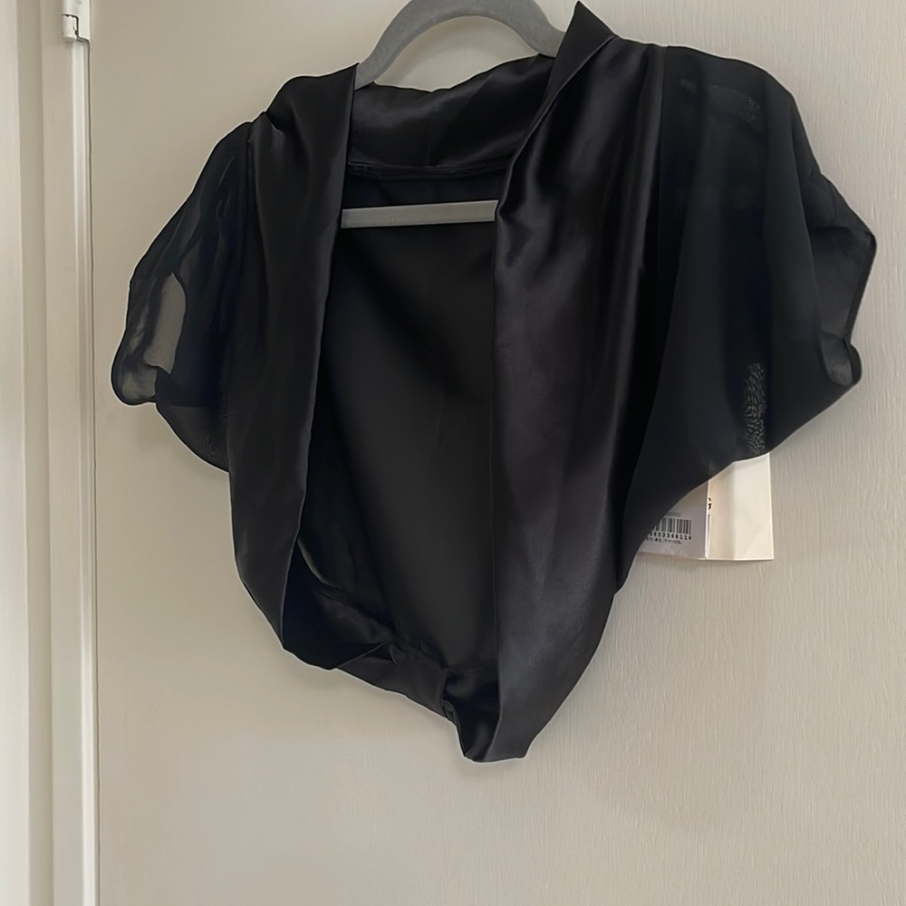 Black shrug, brand new, never worn with tags.